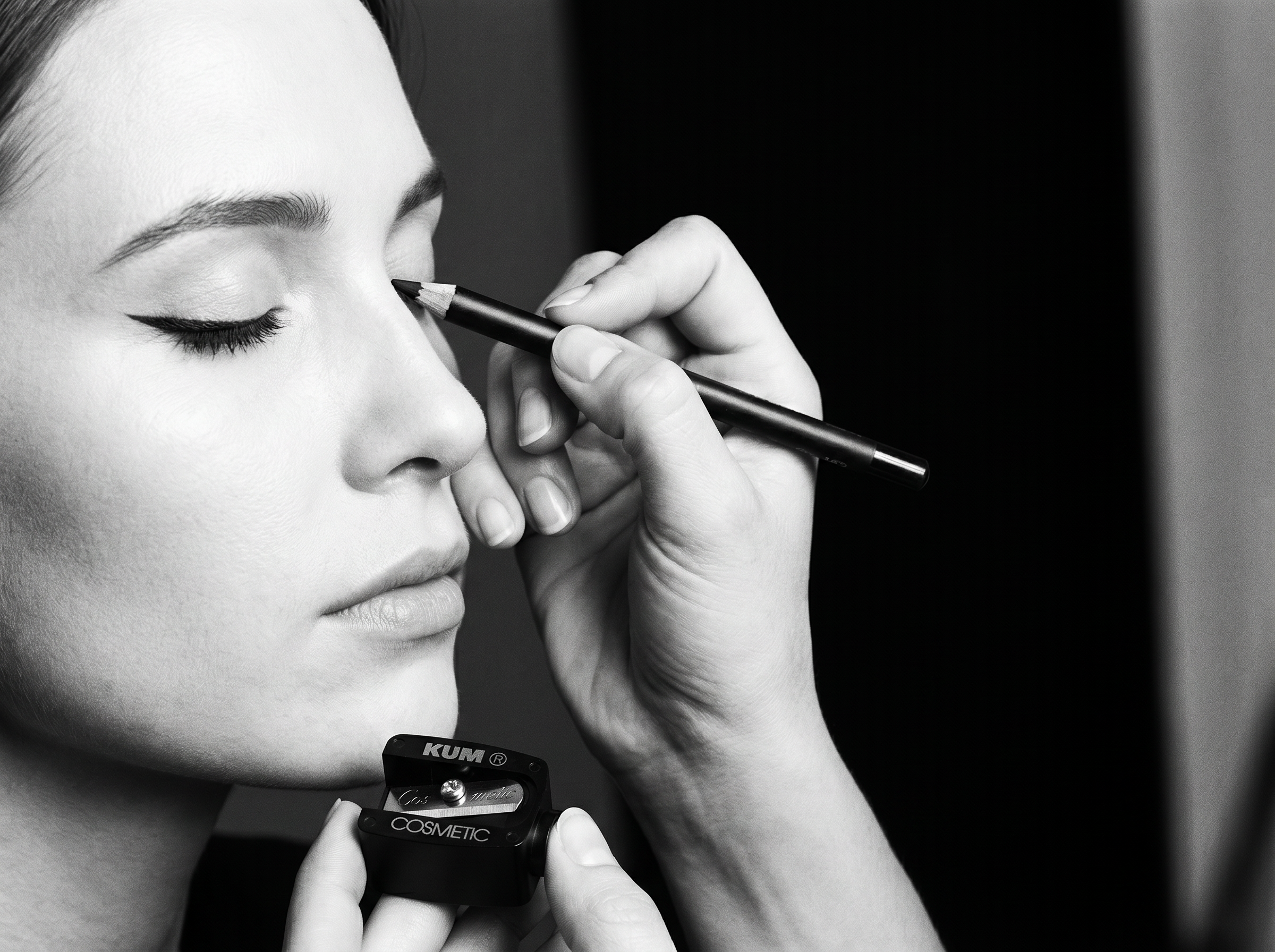 Makeup artist applying eyeliner with a freshly sharpened KUM cosmetic pencil